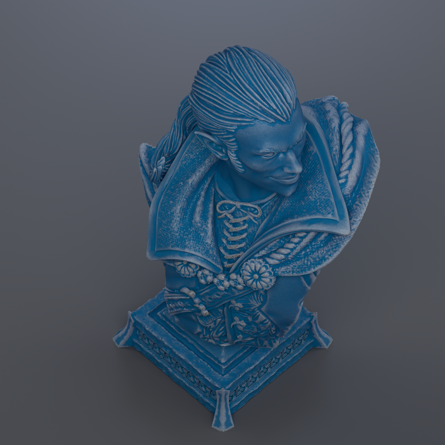 A blue bust sculpture depicting a man with a serious expression, wearing a cape and ornate jewelry.