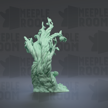 A green, abstract sculpture resembling a tree or plant with intricate, organic shapes and textures.