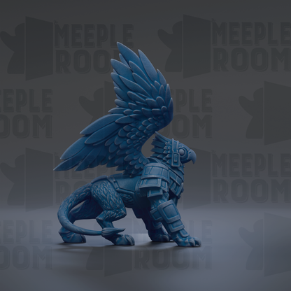 A blue winged creature with a fierce expression stands on a gray surface against a dark background.