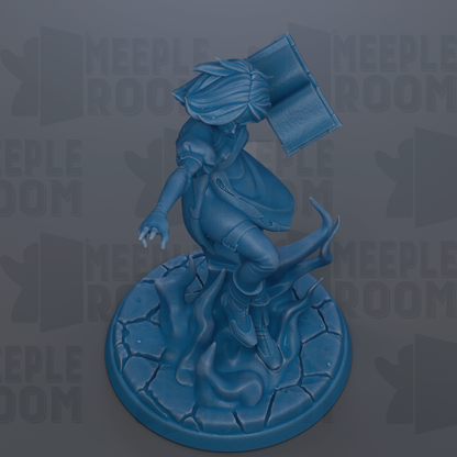 A blue figurine of a person with a book in their hand, standing on a rock formation.