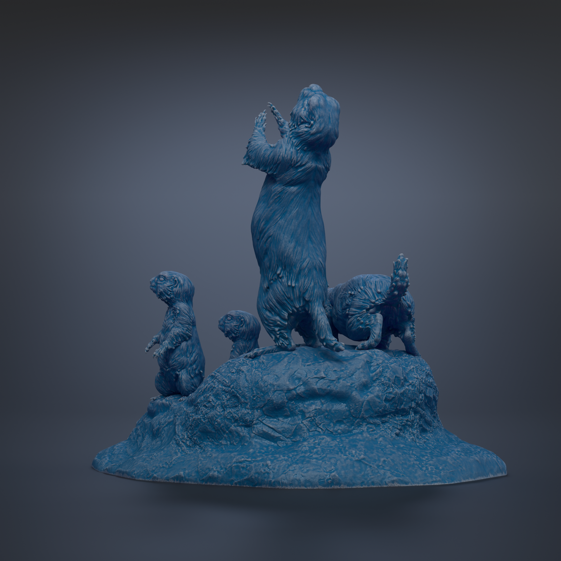 A blue sculpture depicting a group of animals standing on a rock formation.