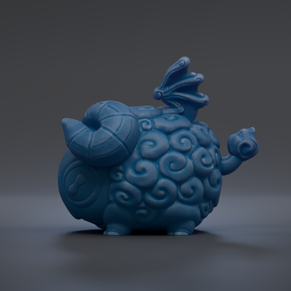 A blue ceramic figurine with a dragon-like design on its head and body, sitting on a dark surface.