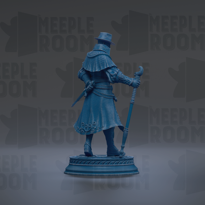 A blue statue of a person holding a staff and sword, standing on a pedestal.