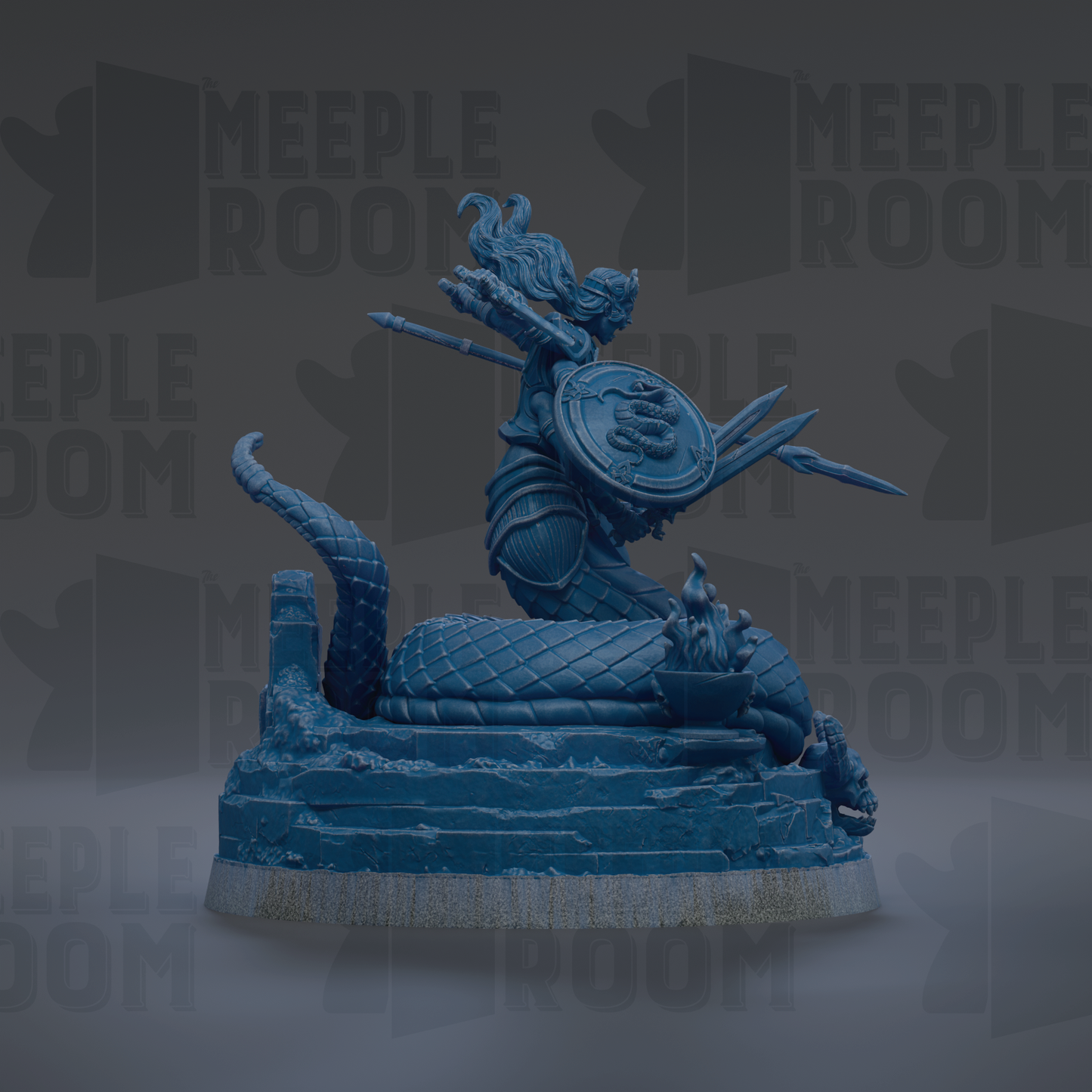 A blue statue of a woman with a shield and sword, sitting on a rock formation.