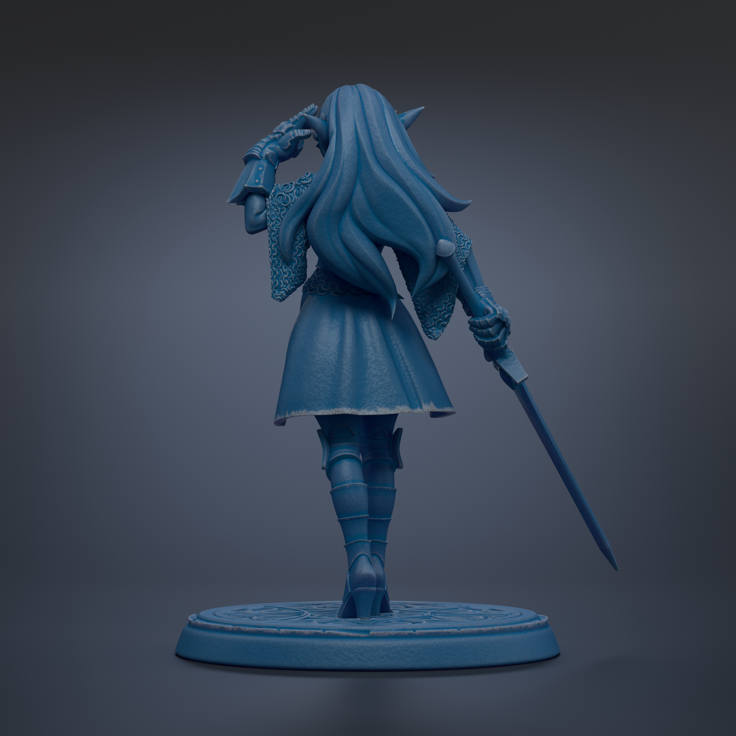 A blue statue of a woman with long hair and a flowing dress, holding a sword and standing on a circular base.