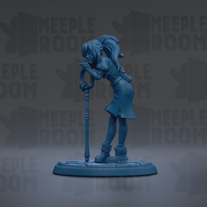 A blue figurine of a woman with a ponytail is standing on a base, holding a cane.