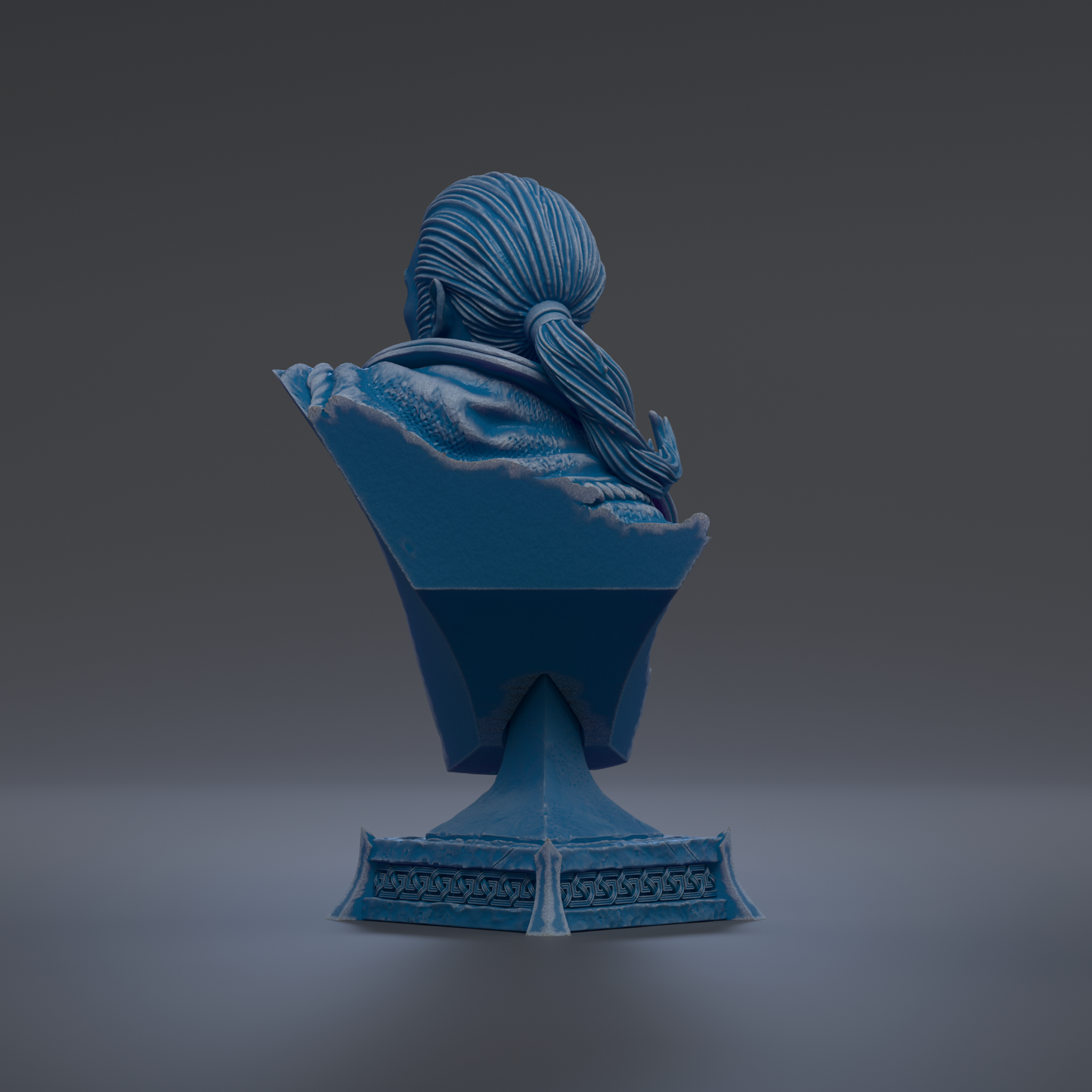 A blue bust sculpture of a person with long hair, sitting on a pedestal with intricate designs.