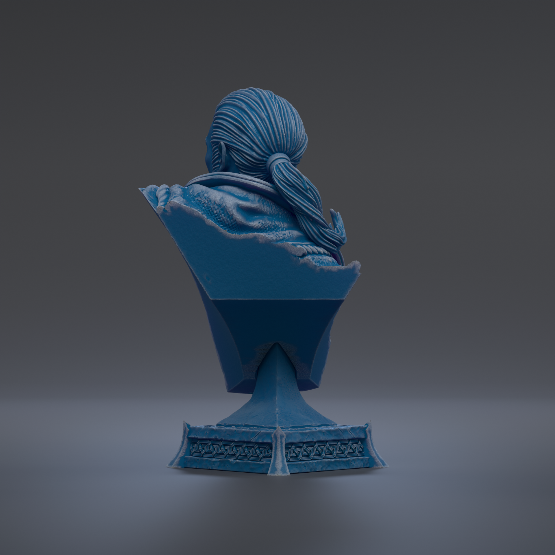 A blue bust sculpture of a person with long hair, sitting on a pedestal with intricate designs.