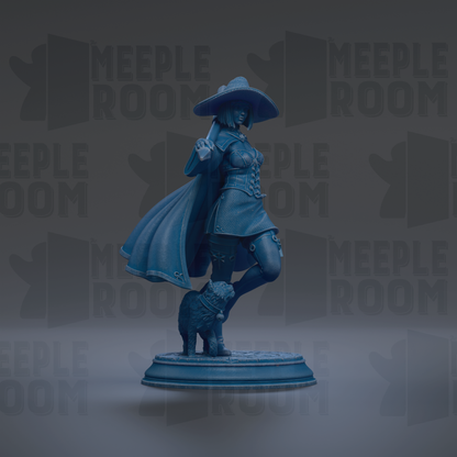 A blue statue of a woman with a large hat and a dog on her feet, standing on a pedestal.