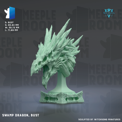 a bust of a swamp dragon, bust, which is a figurine of a dragon with a large head and sharp teeth.