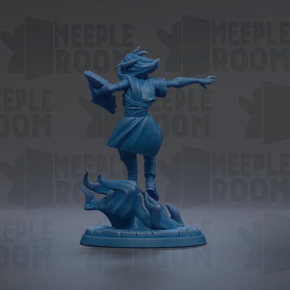 A blue figurine of a person standing on a rock, holding a book in their hand.