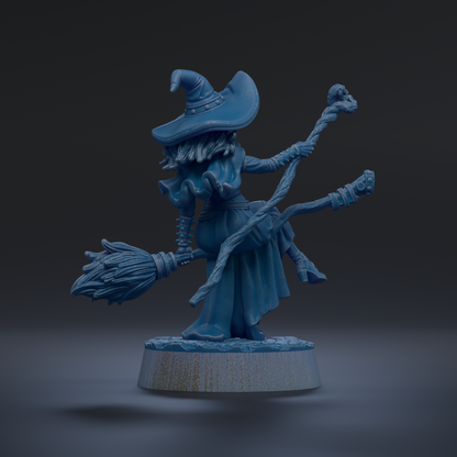 A blue, 3D-rendered fantasy character with a pointed hat, broom, and staff, standing on a base.
