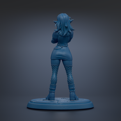 A blue figurine of a woman with long hair and a skirt, standing on a blue base.
