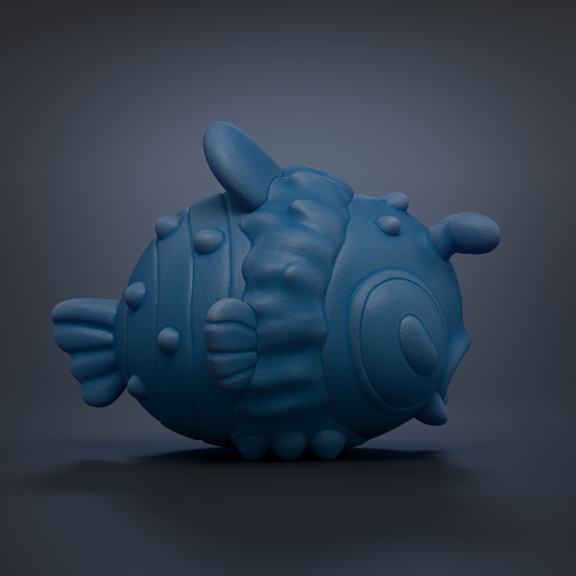 A blue, 3D-rendered fish toy with a textured, bumpy appearance is shown against a dark background.