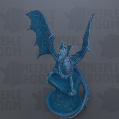 A blue dragon statue with wings spread, sitting on a rock.