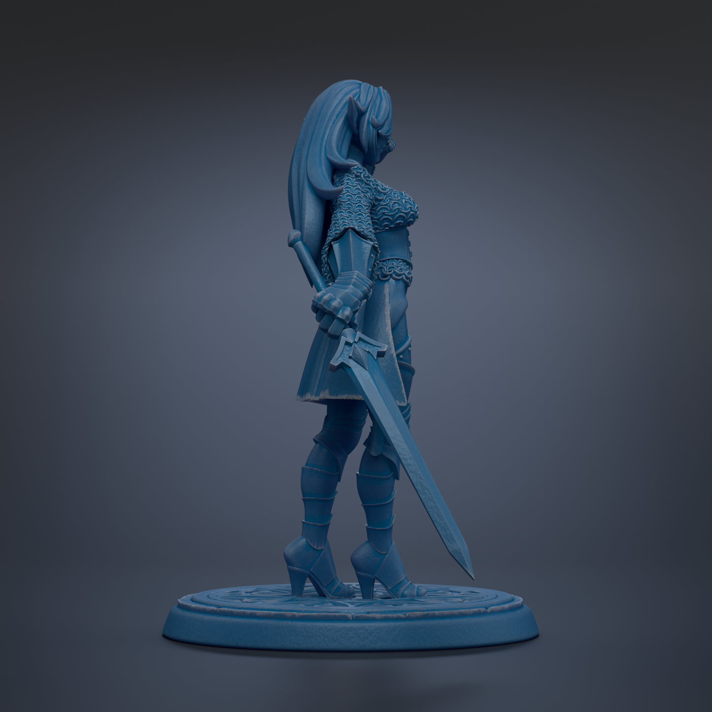 A blue figurine of a female warrior standing with a sword in her right hand.