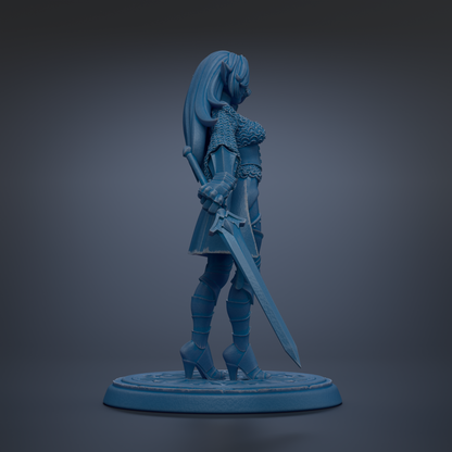 A blue figurine of a female warrior standing with a sword in her right hand.