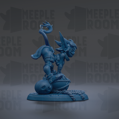 A blue figurine of a cat-like creature with horns and a tail, sitting on a round base with a skull-like object in front of it.