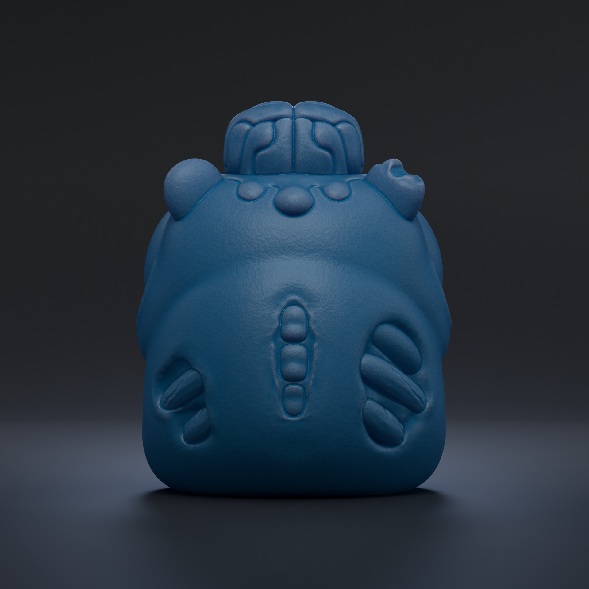 A blue, 3D-rendered object resembling a skull or skull-like figure, with a textured surface and a skull-like head.