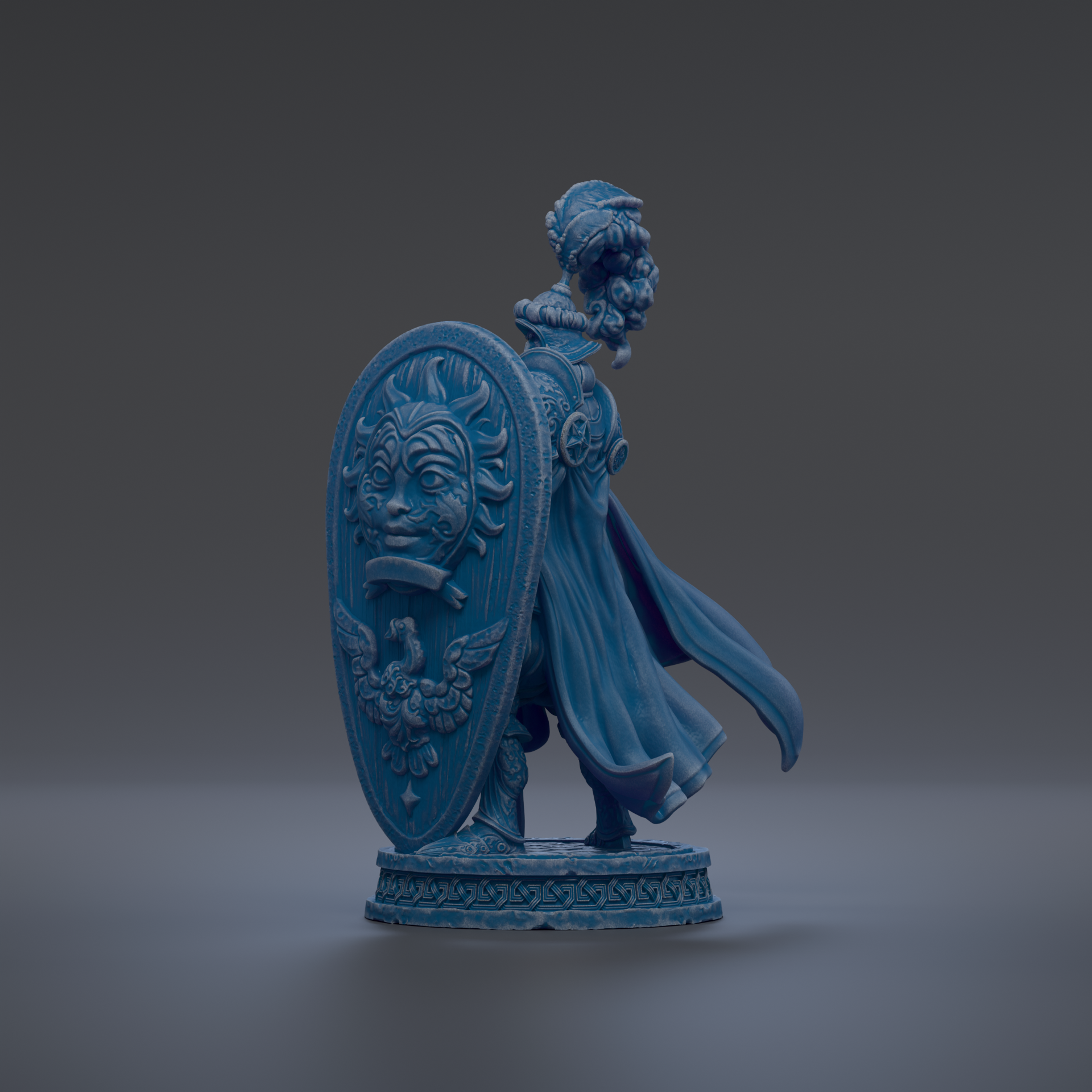 A blue figurine of a person holding a shield with a face on it, standing on a base.