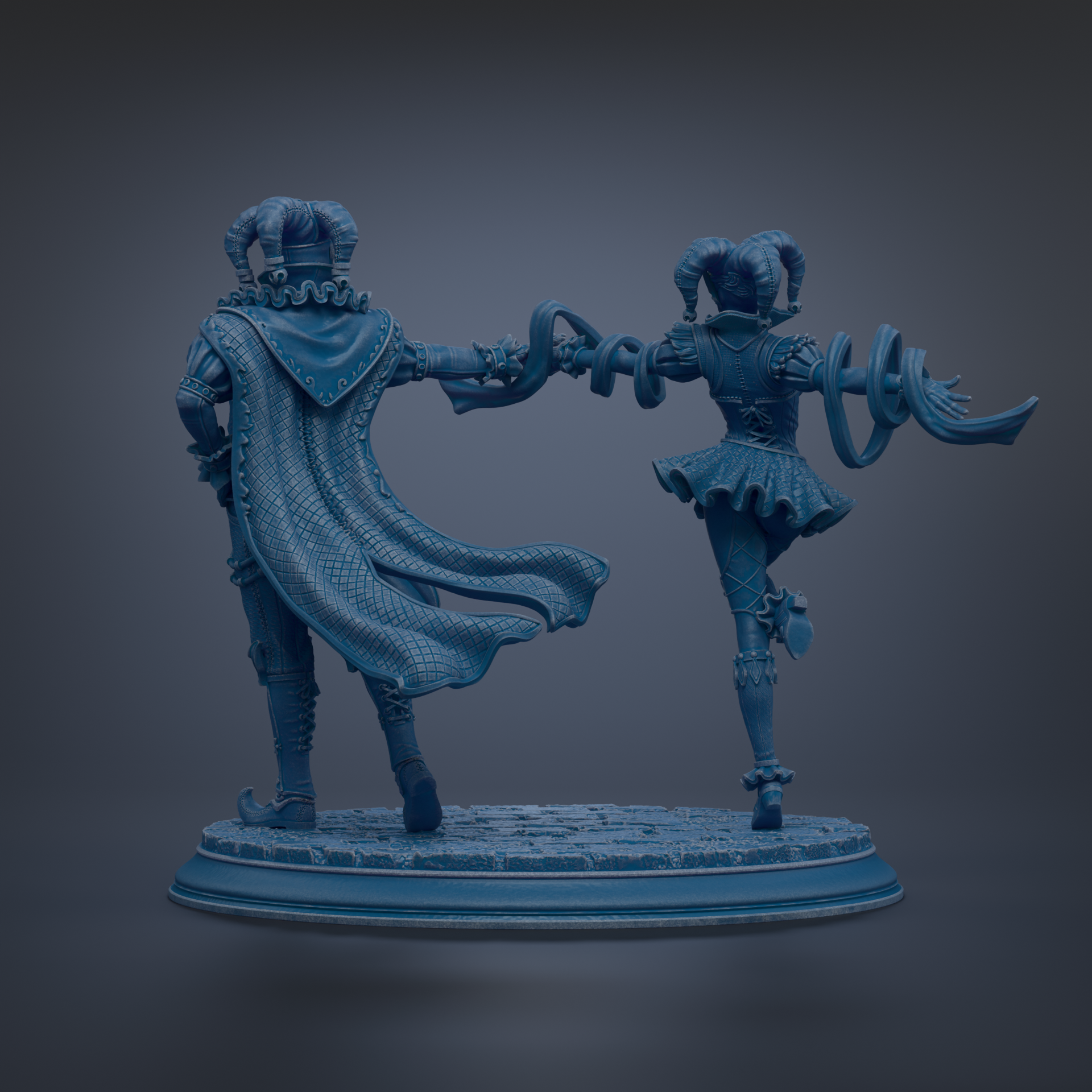 A statue of a man and a woman standing together, with the man wearing a cape and the woman wearing a dress.