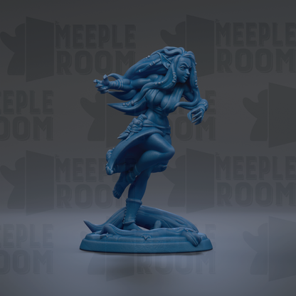 A blue figurine of a woman with long hair and flowing robes, standing on a platform and appearing to be in motion.