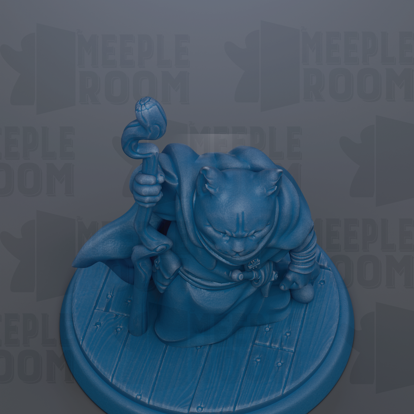 A blue figurine of a cat holding a staff and a scroll, sitting on a wooden base.