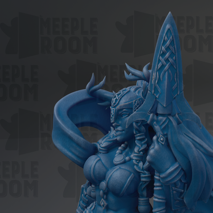 A close-up of a blue, fantastical female figure with intricate details and a flowing, ornate headdress.