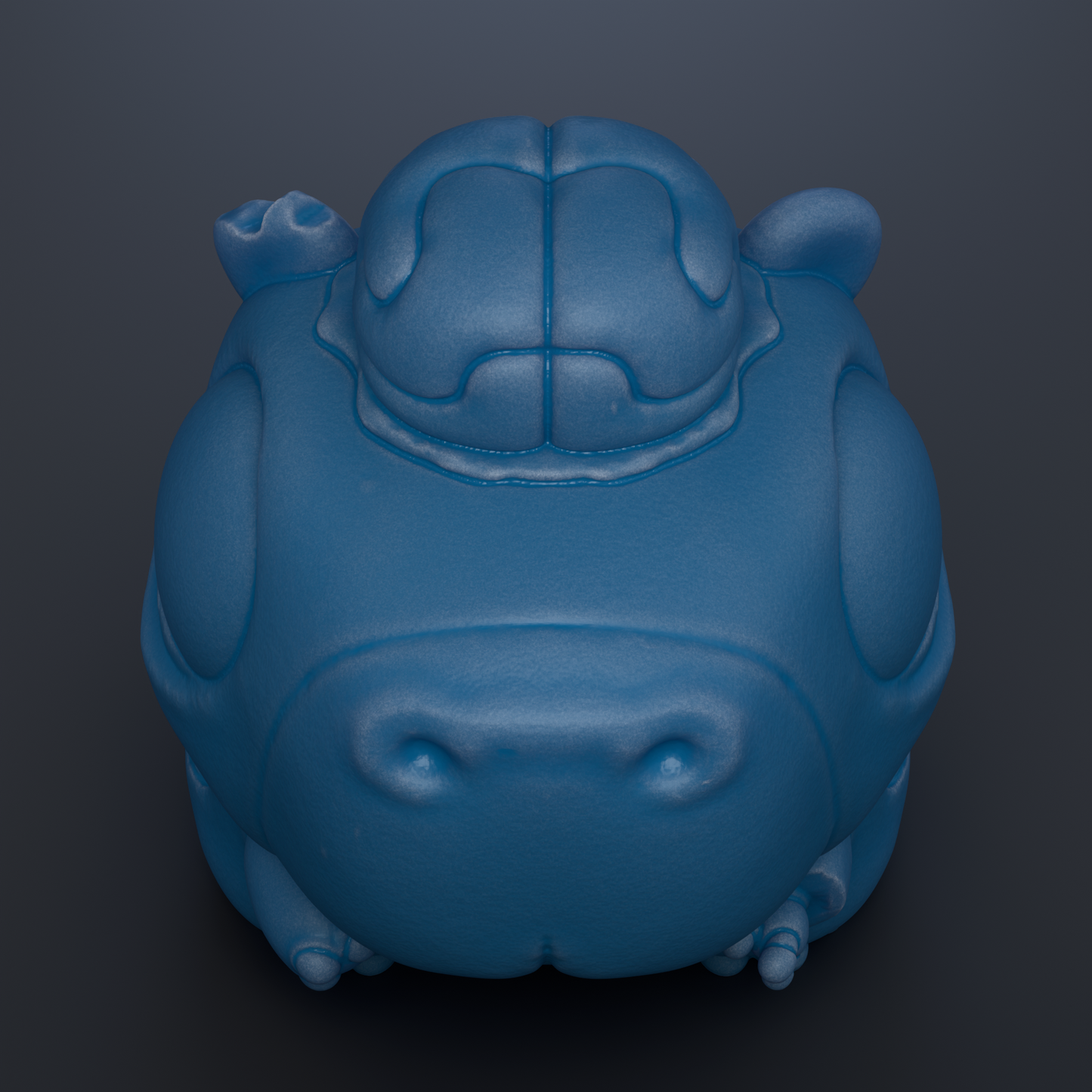 A blue, cartoonish-looking object resembling a frog or a small animal, with a large head and two small ears.