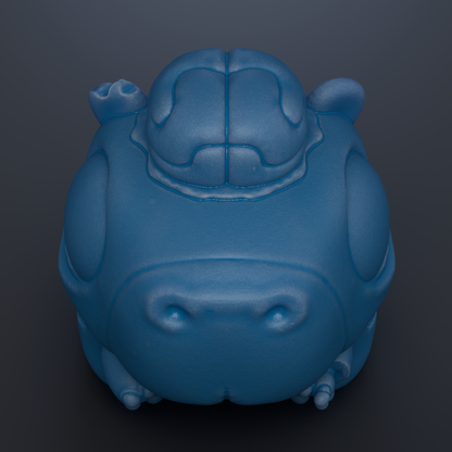 A blue, cartoonish-looking object resembling a frog or a small animal, with a large head and two small ears.