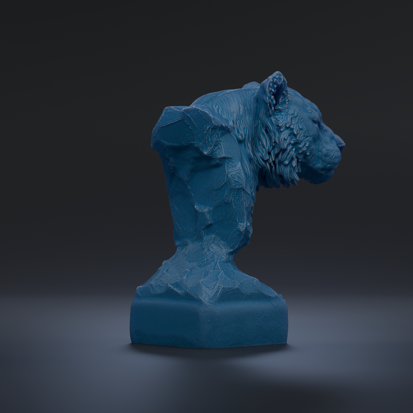 A blue, sculpted statue of a lion's head is displayed against a dark background.