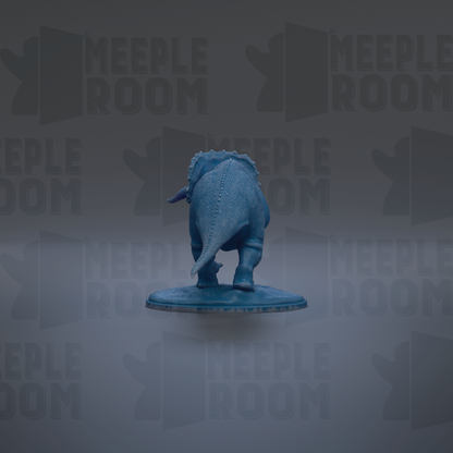 A blue dinosaur figurine is shown against a gray background with repeated text.