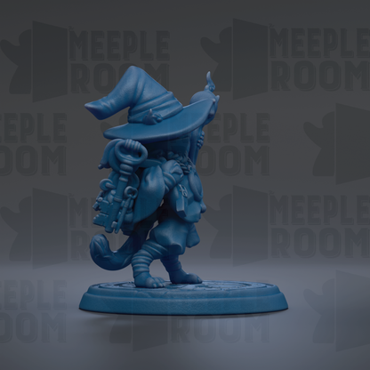 A blue figurine of a wizard or magical character, wearing a pointed hat and carrying a staff, standing on a platform.