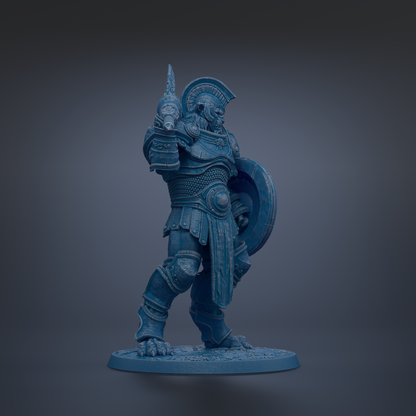 A blue statue of a warrior standing in a fighting stance, holding a shield and sword.