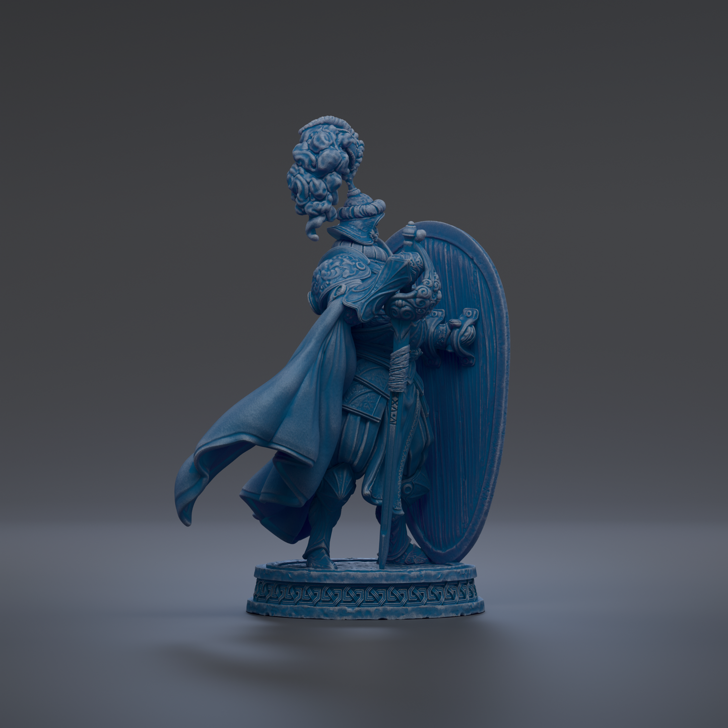 A blue statue of a warrior figure holding a shield and sword, standing on a pedestal.