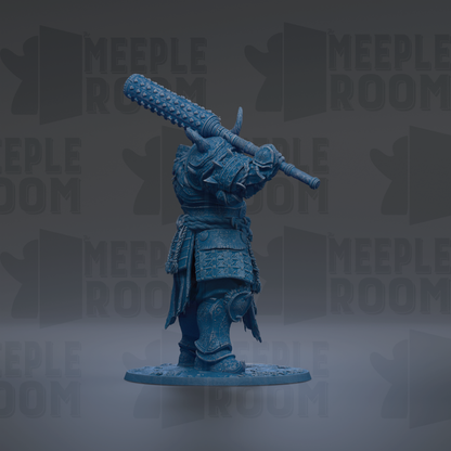 A blue figurine of a warrior standing in a fighting stance, holding a large weapon in its right hand.
