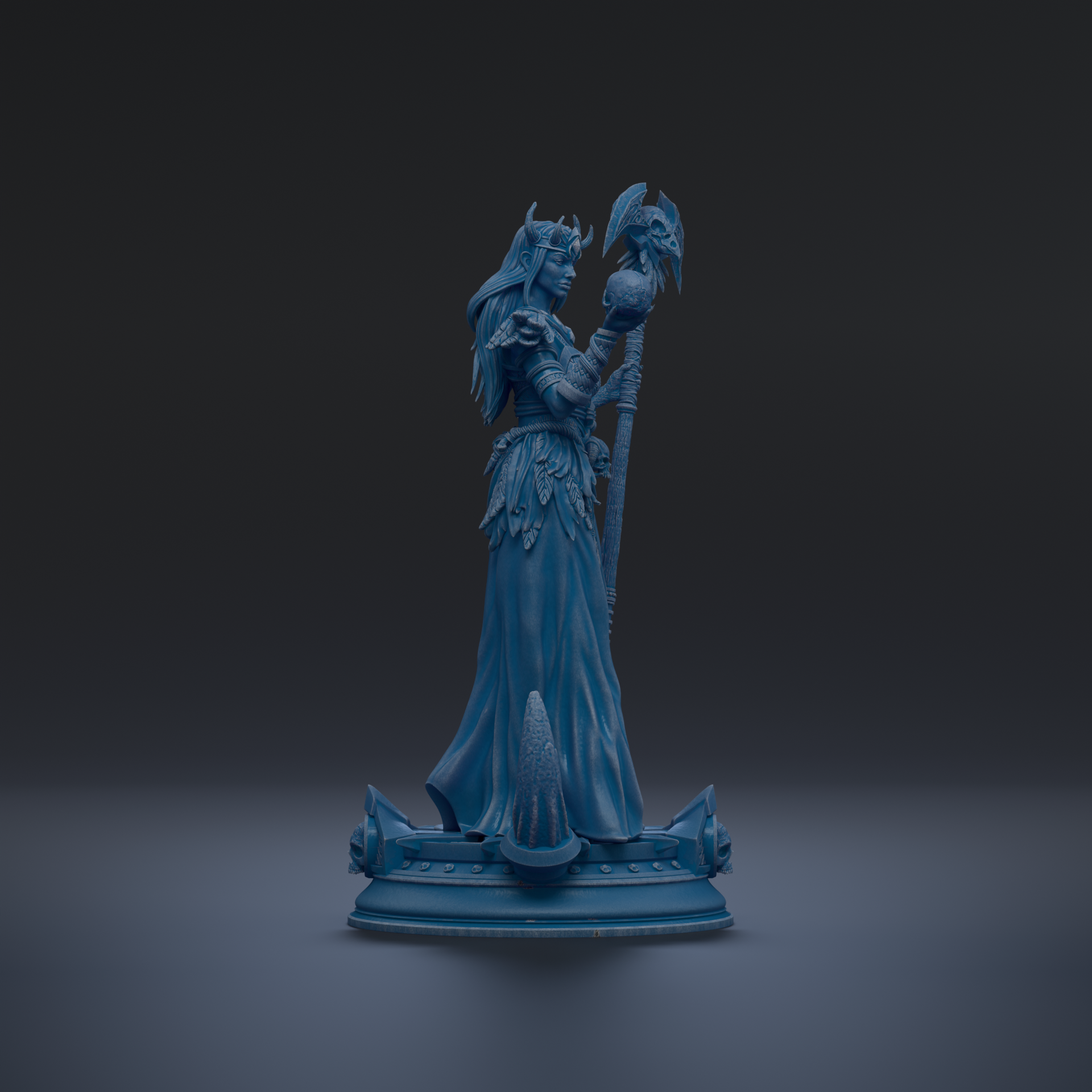 A blue statue of a woman holding a staff and a bird, standing on a pedestal.