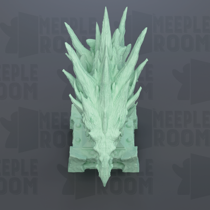 A green, spiky dragon head sculpture is displayed against a dark background with repeated text.