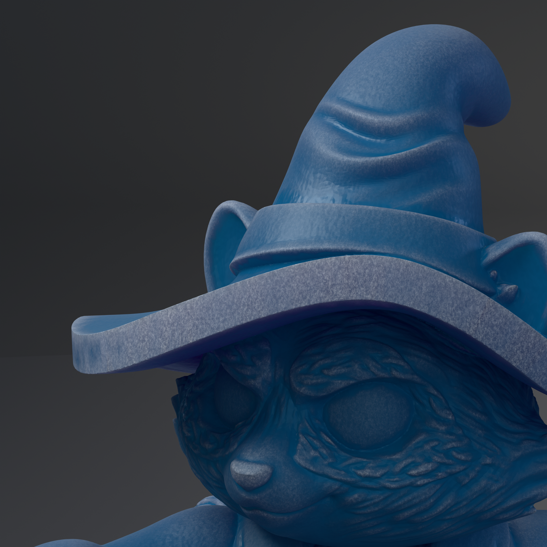 A close-up of a blue, cartoonish-looking cat wearing a pointed hat with a pointed brim.