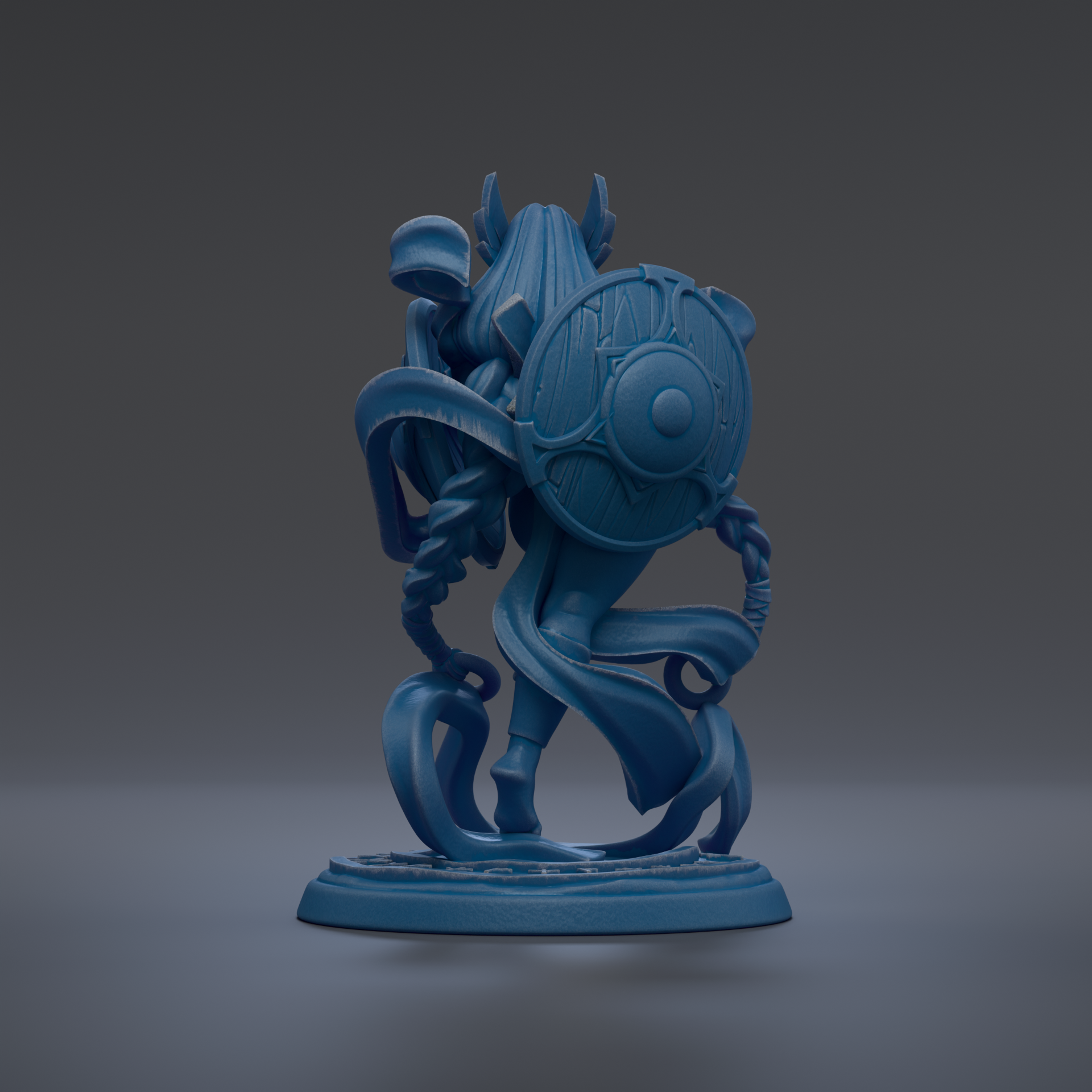 A blue, abstract sculpture with a shield-like design on the back, standing on a base.