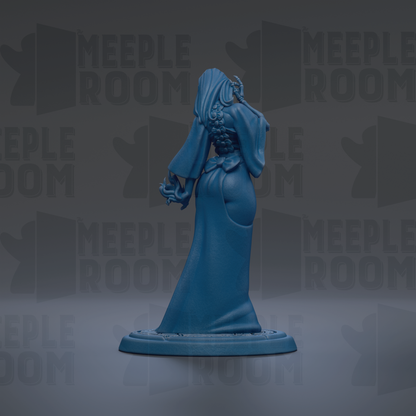 A blue figurine of a woman with a long dress and a headdress, standing on a base and facing away from the camera.