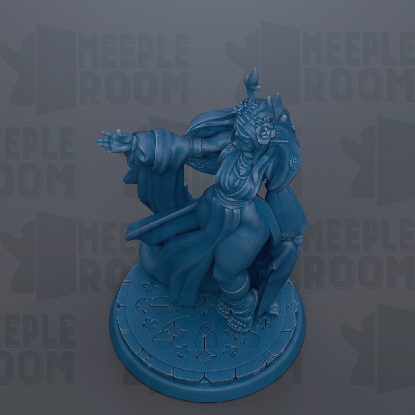 A blue figurine of a character with a flowing robe and a pointed hat, standing on a circular base with a patterned design.