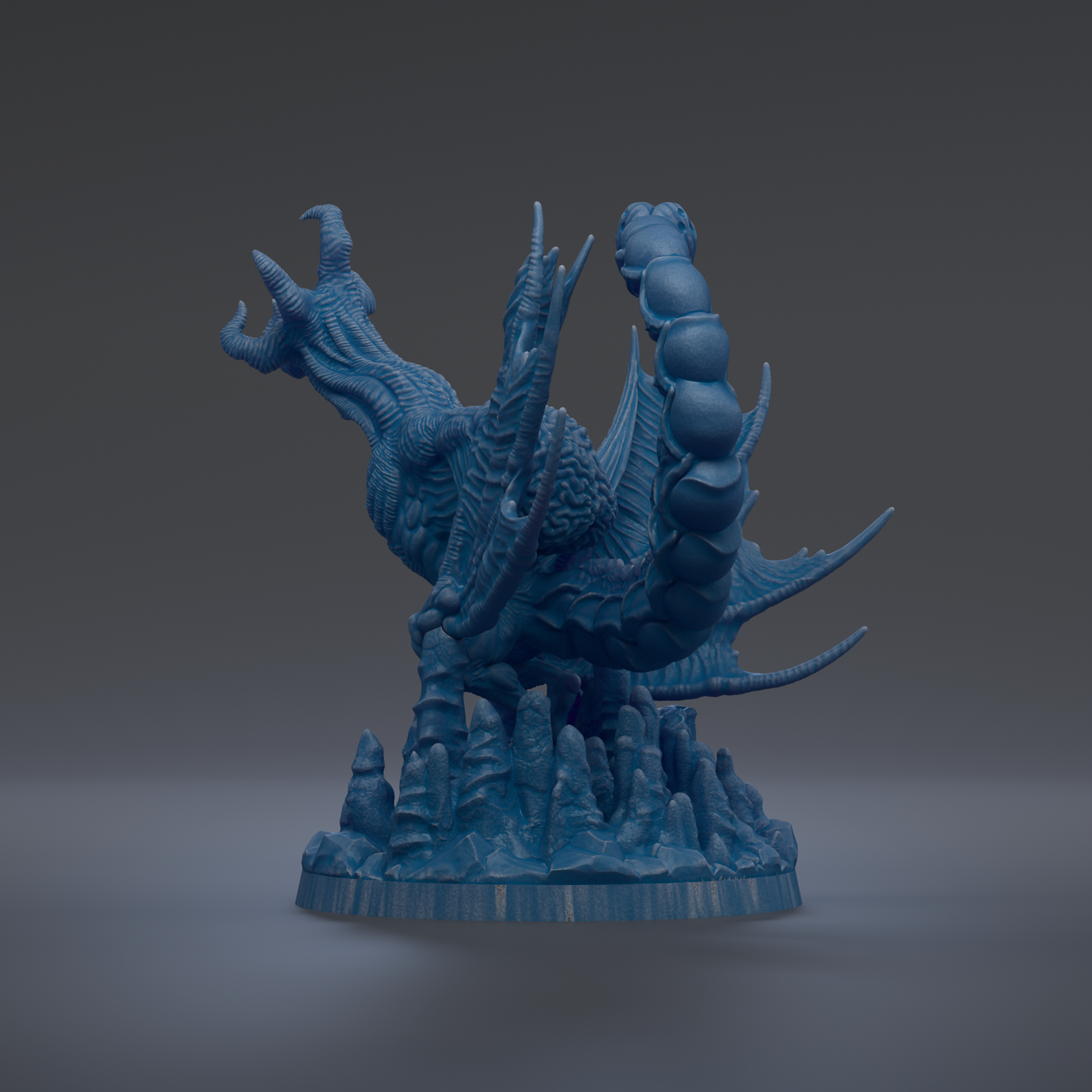 A 3D rendering of a blue dragon-like creature with sharp teeth and claws, standing on a rocky base.