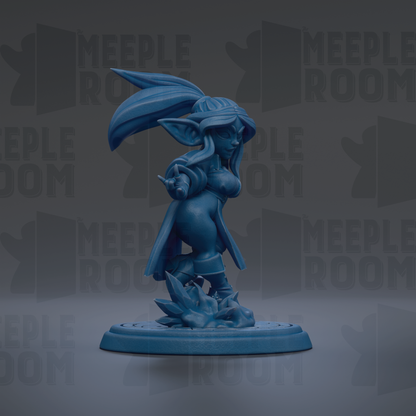 A blue figurine of a female character with a large head and long hair, standing on a platform and holding a weapon.