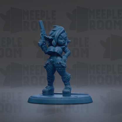 A blue figurine of a female character holding a gun, standing on a base.