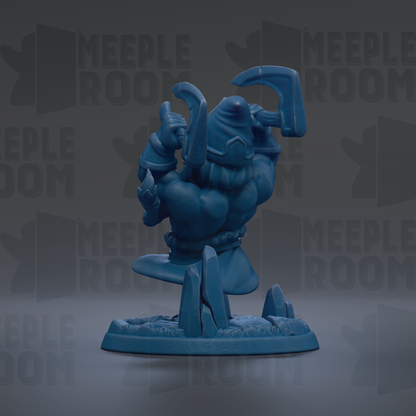 A blue figurine of a character with a sword and shield, standing on a base with a rock formation.