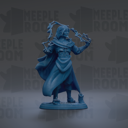 A figurine of a person with a cape and a serious expression, standing in a dark setting.