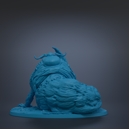 A blue, sculpted creature with horns and a large head sits on a base, facing away from the camera.
