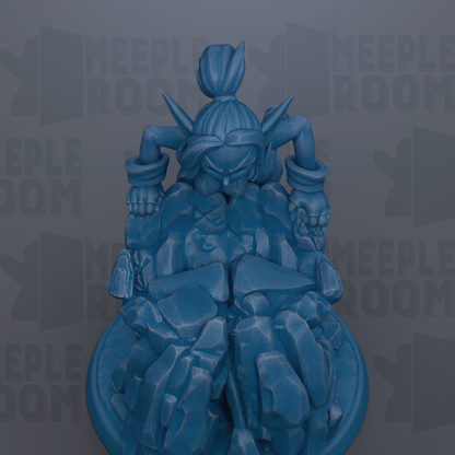A blue, 3D-rendered figurine of a character with a large head and arms, sitting on a rock formation.