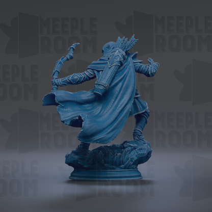 A blue statue of a figure with a bow and arrow, standing on a rock formation.